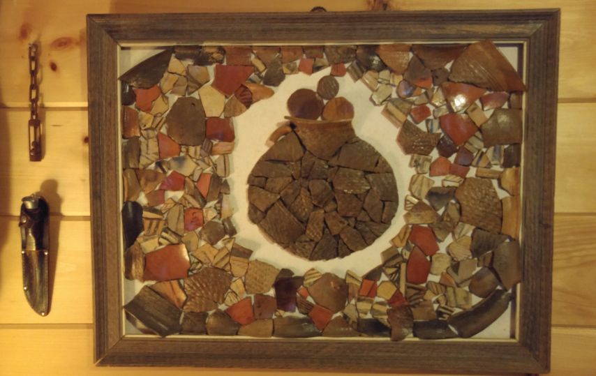 pottery shards in frame forming ceramic pot